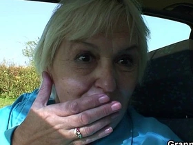 Elderly woman enjoys a steamy encounter in a vehicle